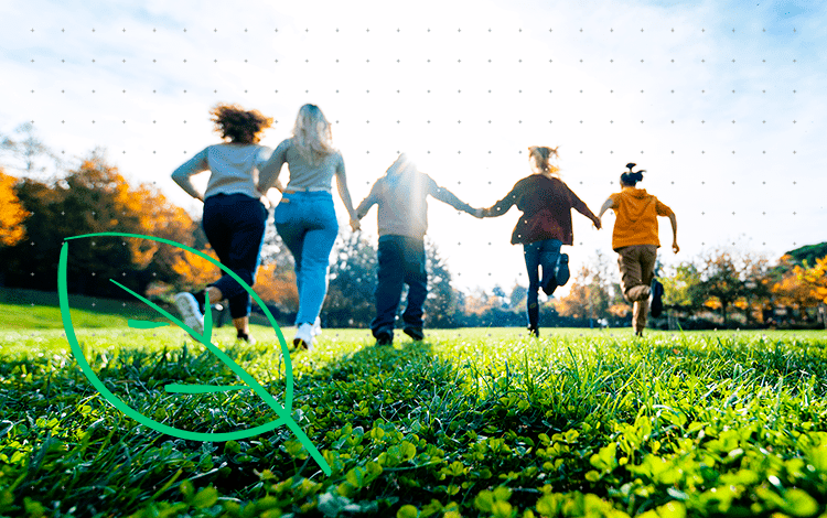 Children run on the grass